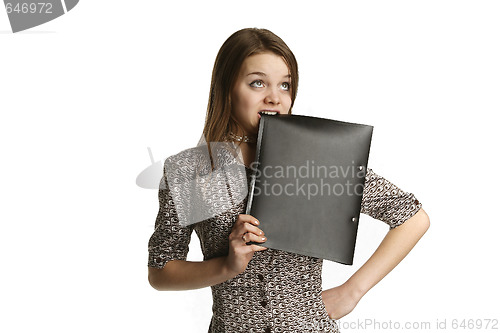Image of Girl biting a folder
