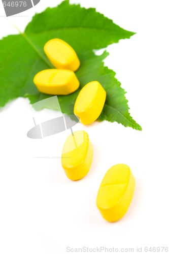 Image of yellow vitamin pills