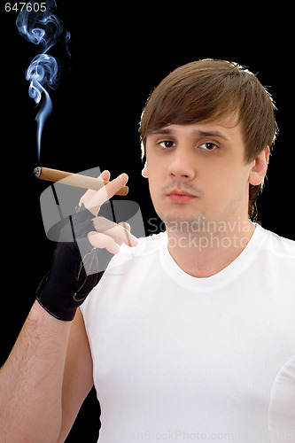 Image of Young man with cigar. Isolated on black