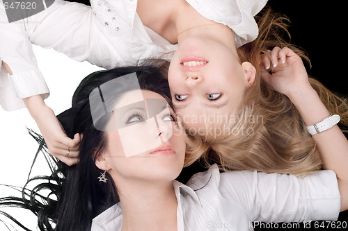 Image of Portrait of the two lying lovely girls