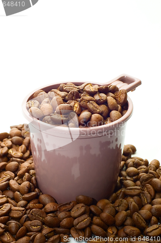 Image of Cup with coffee beans 