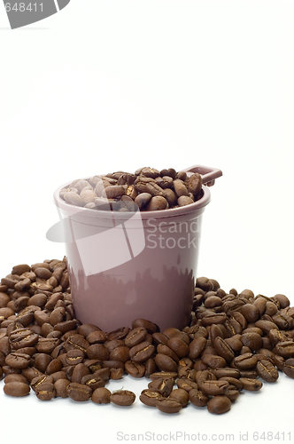 Image of Cup with coffee beans 