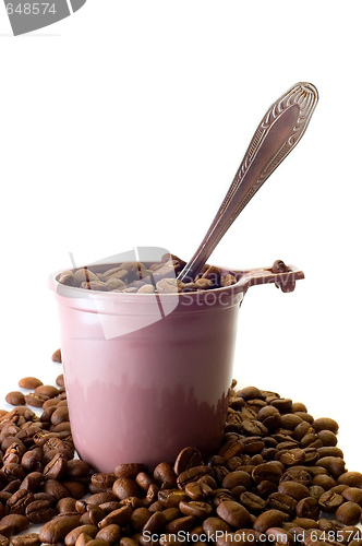 Image of Cup with spoon and coffee beans