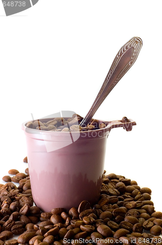 Image of Cup with spoon and coffee beans