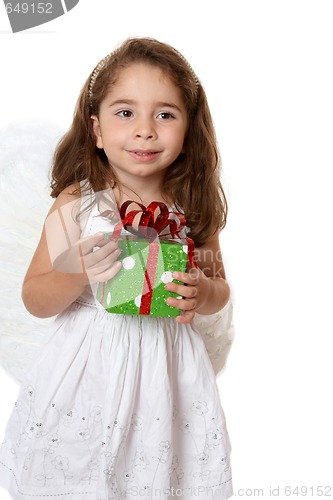 Image of Little angel girl holding a gift