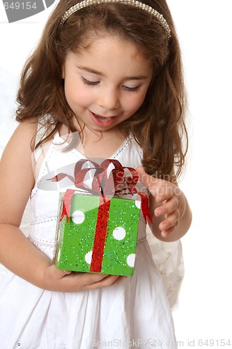 Image of Little girl with a christmas or other present