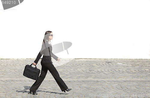 Image of Businesswoman in a hurry