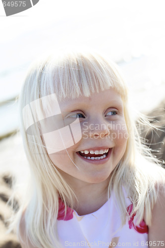 Image of Happy little girl outdoors.