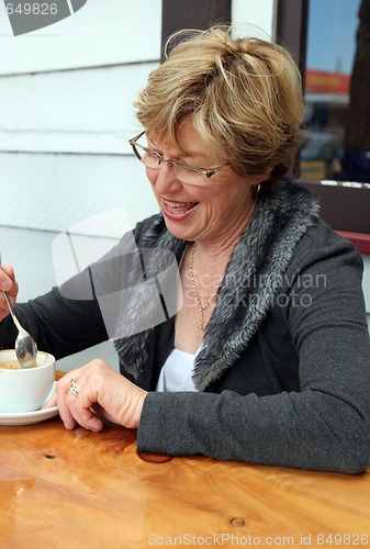 Image of Woman at a cafe.