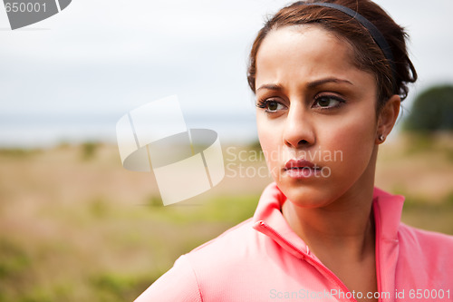 Image of Sporty woman drinking water