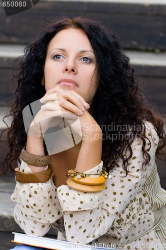 Image of beautiful woman with a book 