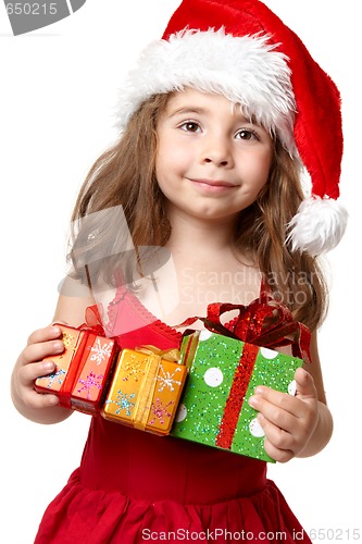 Image of Little girl holding Christmas Presents