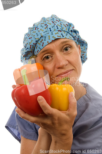 Image of nurses promoting healthy diet with fresh colorful bell peppers