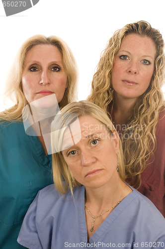 Image of three nurses medical females with serious expression