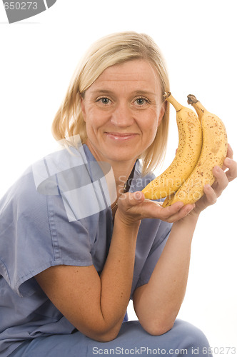 Image of smiling happy nurse doctor with healthy fresh vegetables food