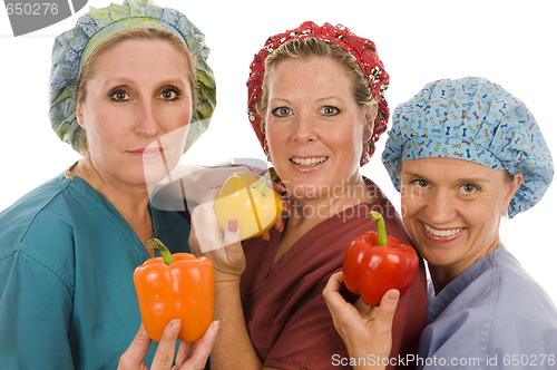 Image of  nurses promoting healthy diet with fresh colorful bell peppers 