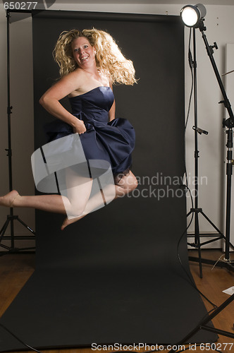 Image of glamorous woman posing in cocktail dress