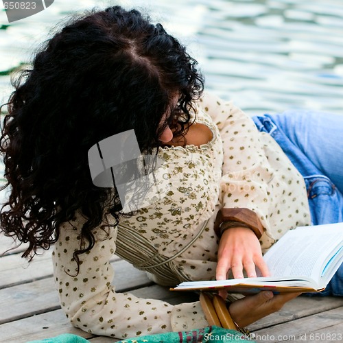 Image of woman reading a book 