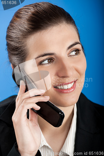 Image of Businesswoman calling at phone