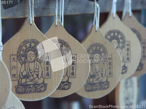 Image of Wooden badges of Buddha