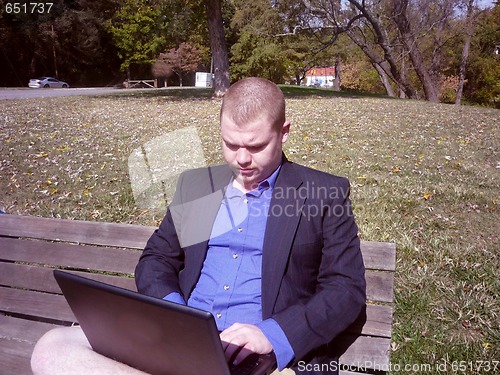 Image of Young man on laptop