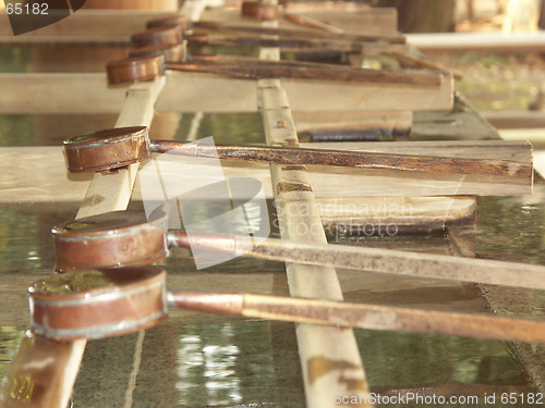 Image of Water buckets in a Japanese shrine