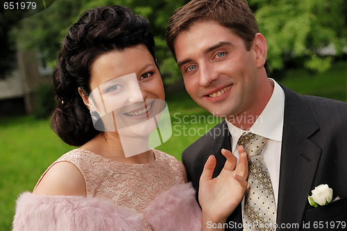 Image of Close-up portrait of young smiling couple outdoors