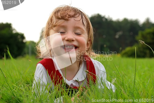 Image of Little girl expressing fun with closed eyes