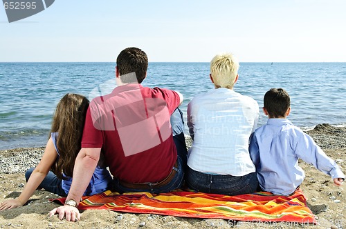 Image of Family sitting at beach