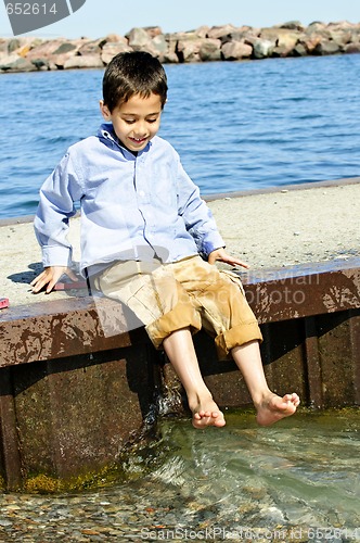 Image of Boy playing on pier