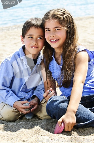 Image of Brother and sister at beach