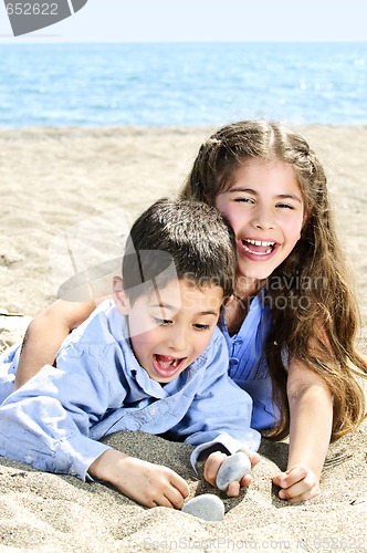 Image of Brother and sister at beach