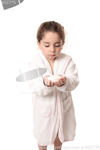 Image of Little girl about to wash her hands with soap