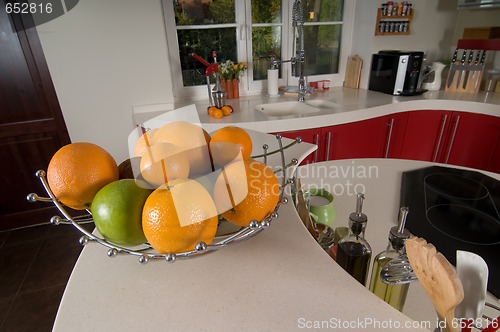 Image of Fruits on red modern kitchen
