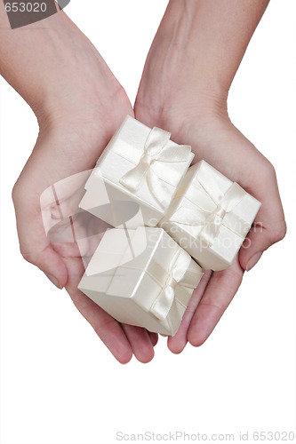 Image of Hand and and White Gifts