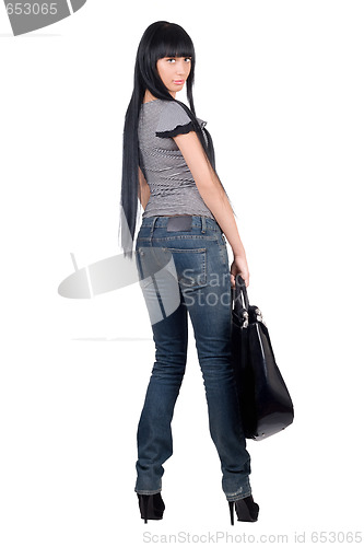 Image of Beautiful girl with a handbag. Isolated on white