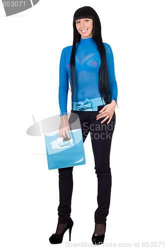 Image of Smiling girl with a blue handbag. Isolated