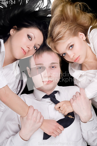 Image of Portrait if the young man and two pretty girls