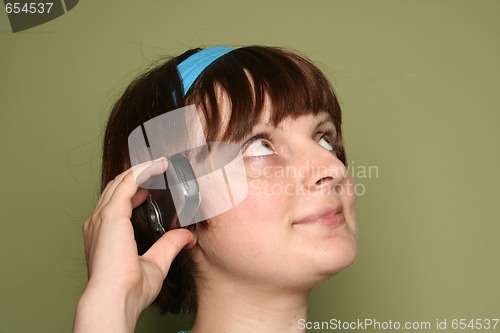 Image of young woman calling by cellular phone