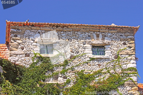 Image of Facade of an old stone house