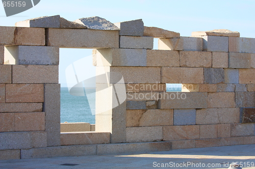 Image of stone wall against blue sky