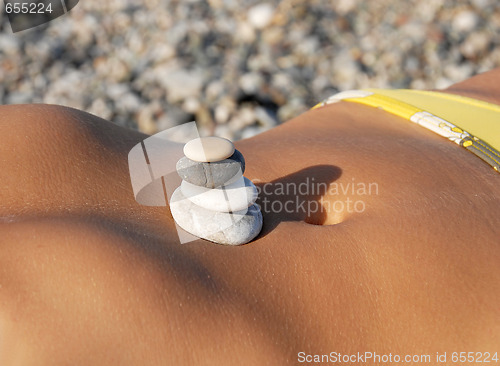 Image of Rocks stack on stomach