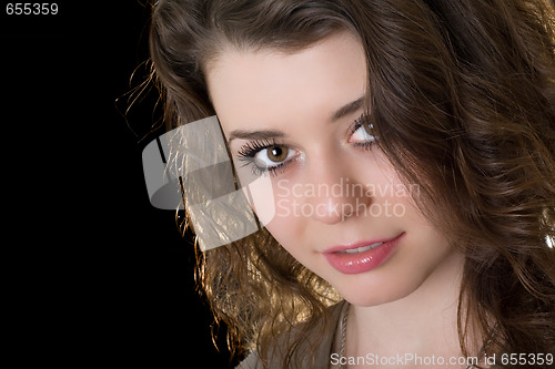 Image of Portrait of the beautiful girl. Isolated on black