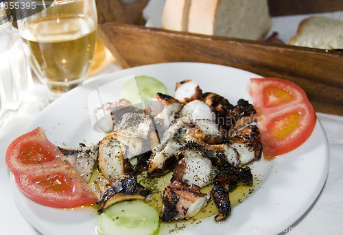 Image of greek island taverna specialty of marinated grilled octopus