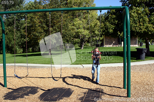 Image of Little Boy Swinging