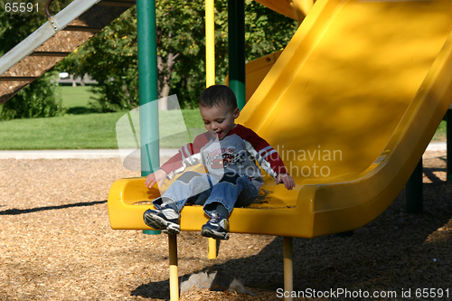 Image of Little Boy Sliding