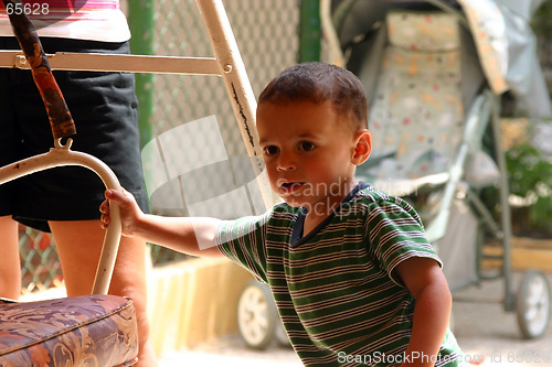 Image of Little Boy Pushing the Swing