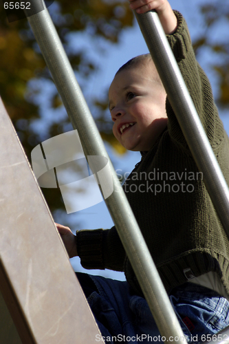 Image of Kid Climbing Up the Slider