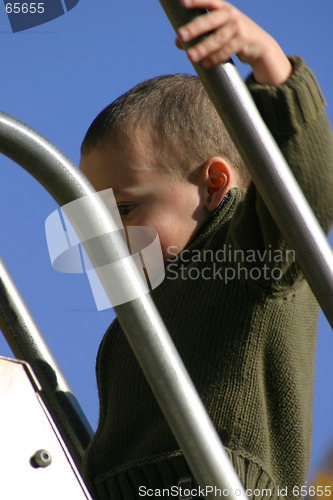 Image of Kid Climbing Up the Slider
