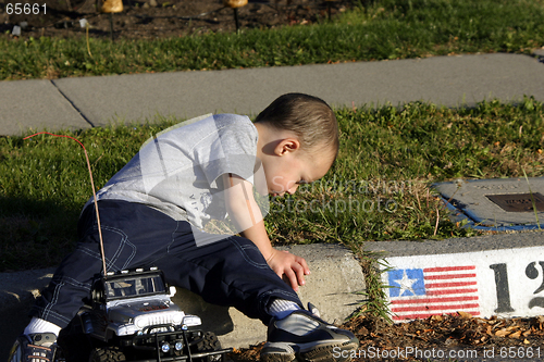 Image of Little Boy Looking At the Ants